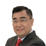 Professional headshot of a middle-aged man in a dark suit and red tie, smiling at the camera, white background