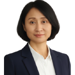 Professional headshot of a woman with shoulder-length black hair, wearing a navy blazer and white blouse, looking at the camera.
