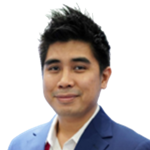 Portrait of a man with short black hair, wearing a blue blazer and white shirt, smiling at the camera.